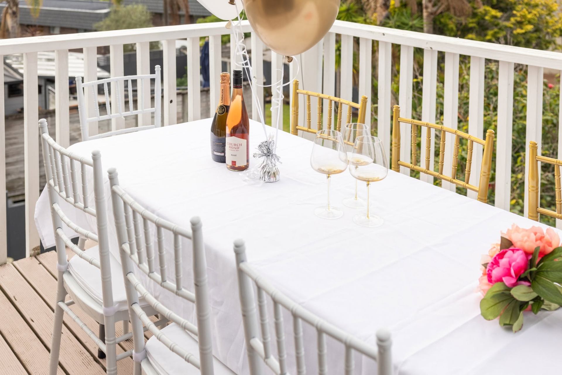 Elegant table and chair hire setup on an Auckland deck